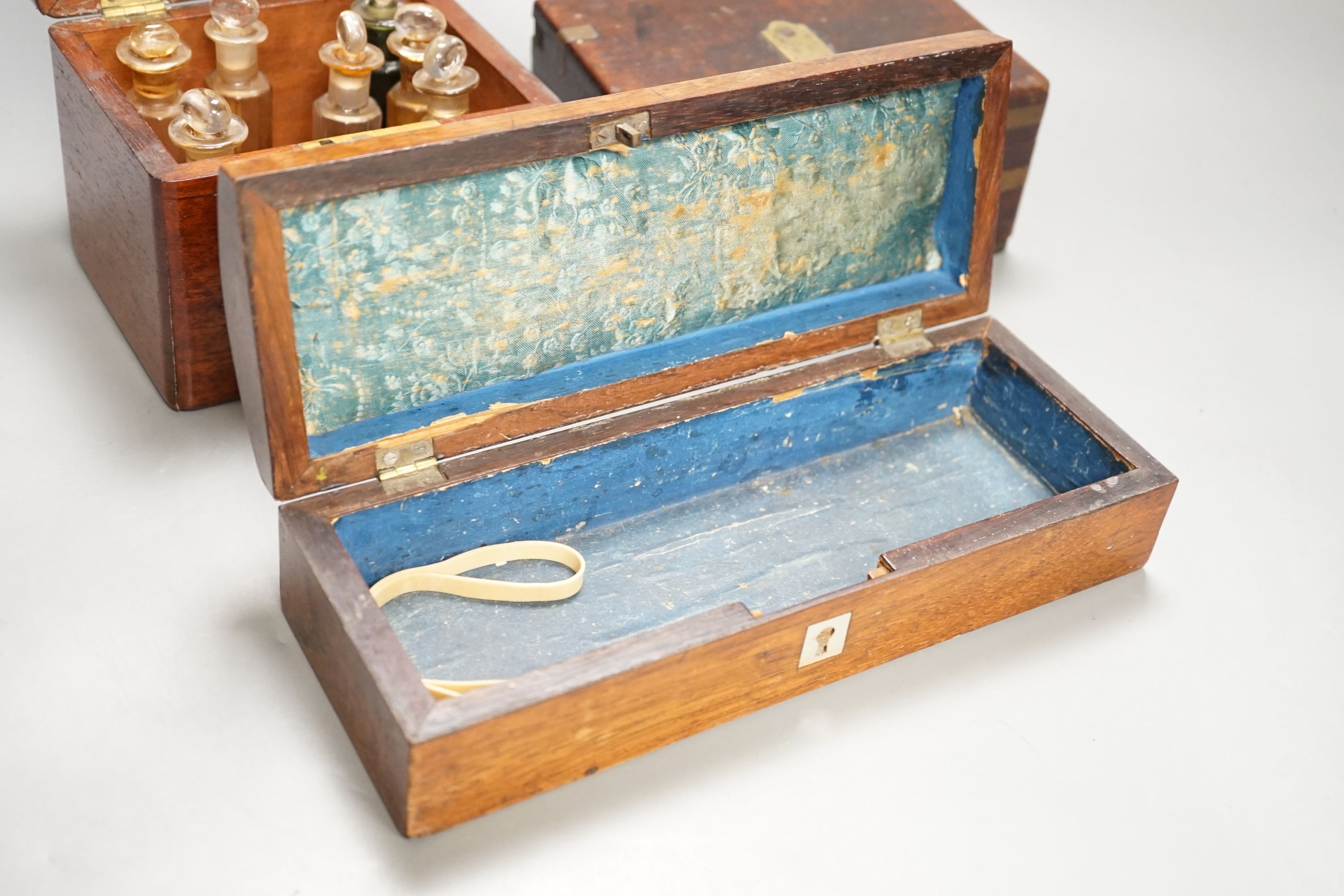 A Victorian mahogany medicine case, with bottles, 13cm. wide, a brass-mounted box and a rosewood veneered pen box